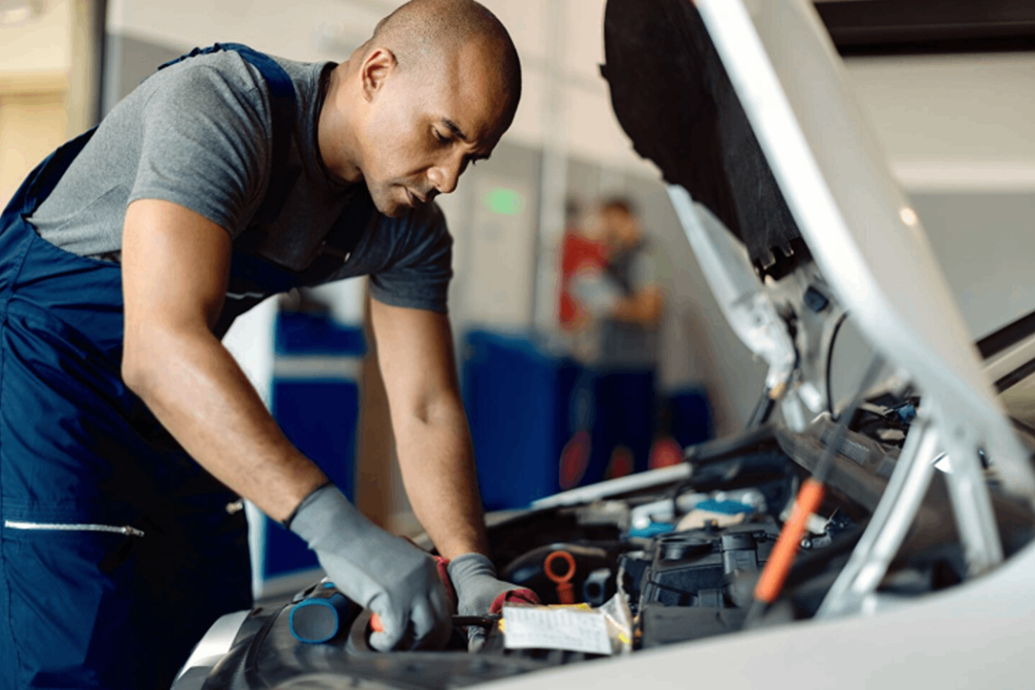 Automechanic repairing the car in a mechanical service.
